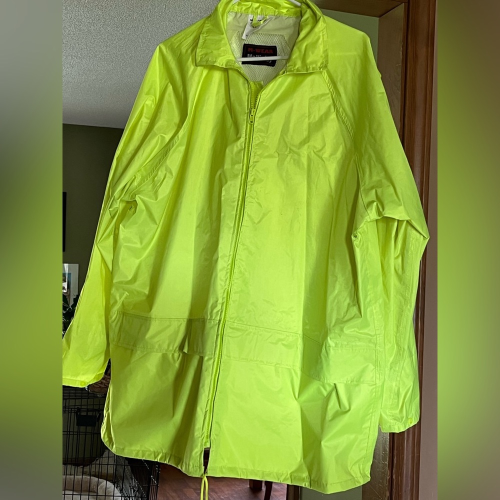 Neon green rain jacket 1XL M-Wear McKinley. Has a hood and two front pockets.